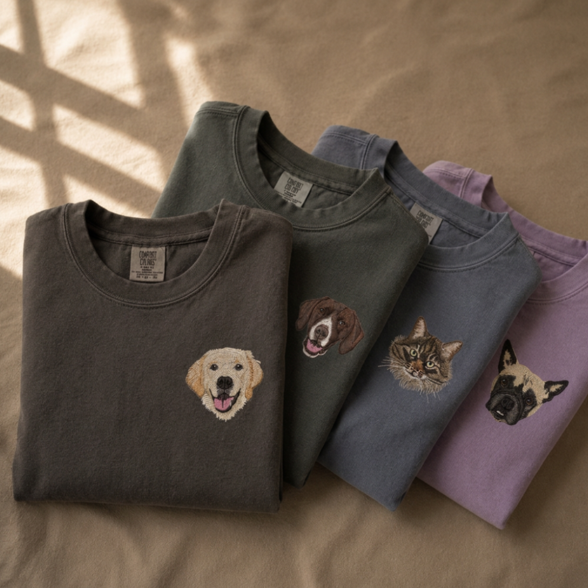 Custom embroidered pet portrait Comfort Colors sweatshirts in Pepper, Blue Jean and Orchid with dog and cat portraits