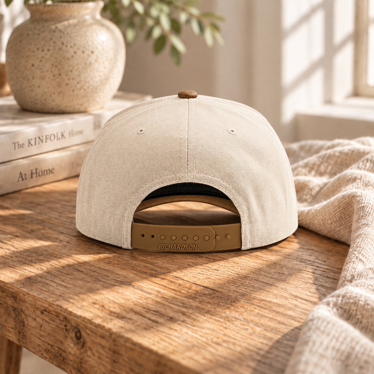 Back of the custom embroidered pet snapback hat showing the adjustable snap closure, cream with brown brim