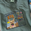 Video close-up of a custom embroidered Greetings From Kya postcard sweatshirt with a dog portrait on a beach scene